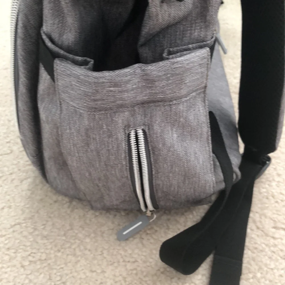 Baby changing gray backpack with multiple pockets